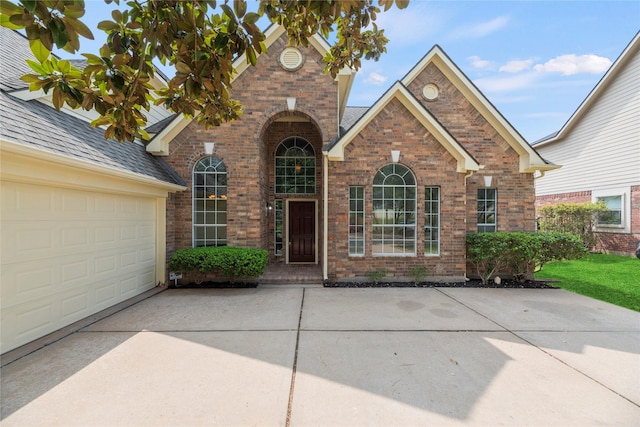 3427 Powell Way, Missouri City, TX 77459 - view of front of property with brick siding, driveway, and a garage