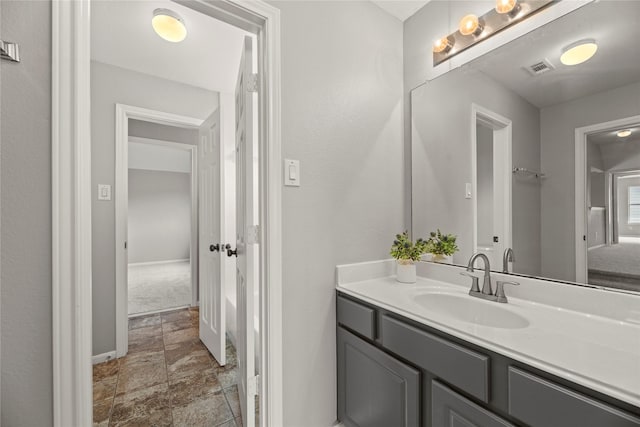 3427 Powell Way, Missouri City, TX 77459 - bathroom featuring stone finish flooring, vanity, and baseboards