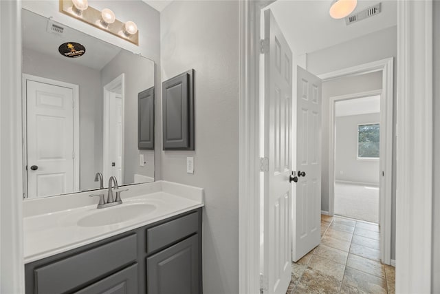 3427 Powell Way, Missouri City, TX 77459 - bathroom featuring baseboards, vanity, and stone finish flooring