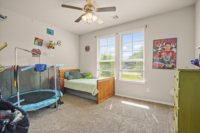 22078 Sun Haven Ln, Porter, TX 77365 - carpeted bedroom with baseboards and ceiling fan