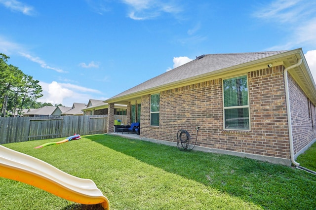 22078 Sun Haven Ln, Porter, TX 77365 - rear view of house with brick siding and a patio area