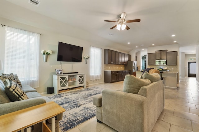 22078 Sun Haven Ln, Porter, TX 77365 - living area featuring a ceiling fan, light tile patterned floors, recessed lighting, and baseboards