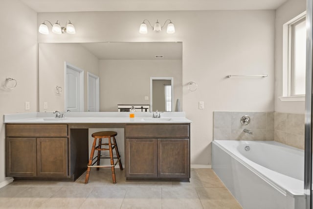 22078 Sun Haven Ln, Porter, TX 77365 - full bath featuring tile patterned flooring, double vanity, a bath, and baseboards