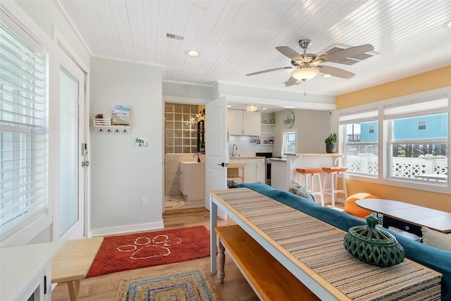 1010 Fort Velasco Dr, Surfside Beach, TX 77541 - dining room with light wood-type flooring, a ceiling fan, wood ceiling, baseboards, and recessed lighting