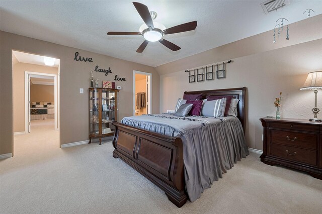 16325 Senkel Rd, East Bernard, TX 77435 - bedroom featuring light carpet, baseboards, and a ceiling fan