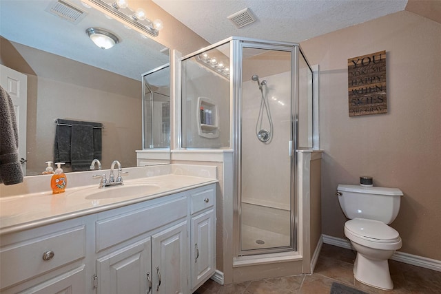 16325 Senkel Rd, East Bernard, TX 77435 - bathroom with a shower stall, vanity, toilet, tile patterned flooring, and a textured ceiling