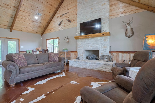 16325 Senkel Rd, East Bernard, TX 77435 - living room featuring wood ceiling, beam ceiling, high vaulted ceiling, a fireplace, and a wainscoted wall