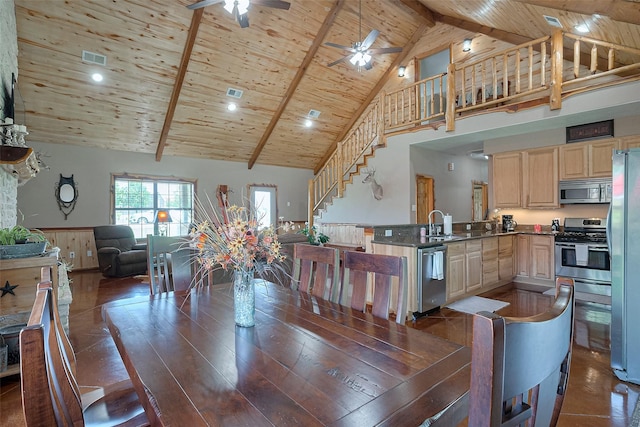16325 Senkel Rd, East Bernard, TX 77435 - dining area with high vaulted ceiling, stairway, wood ceiling, a ceiling fan, and beamed ceiling