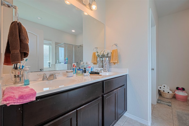 10027 Yanet Grove Ln, Houston, TX 77044 - full bathroom featuring a shower stall, double vanity, and tile patterned floors