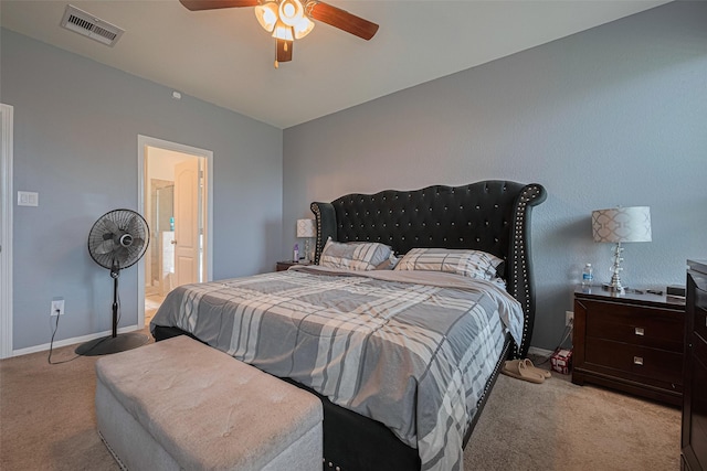 10027 Yanet Grove Ln, Houston, TX 77044 - carpeted bedroom with baseboards, ceiling fan, and connected bathroom