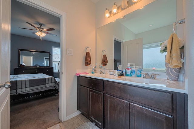 10027 Yanet Grove Ln, Houston, TX 77044 - ensuite bathroom with ceiling fan, double vanity, and tile patterned floors