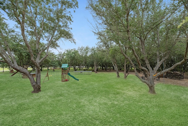 4439 W Bayshore Rd, Anahuac, TX 77514 - view of grassy yard with a playground