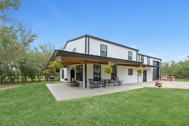 4439 W Bayshore Rd, Anahuac, TX 77514 - rear view of house featuring a patio area and a yard