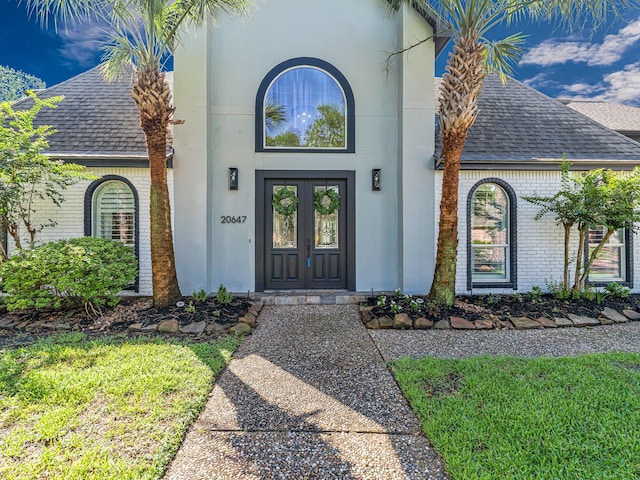 20647 Laurel Lock Dr, Katy, TX 77450 - entrance to property with a shingled roof and brick siding