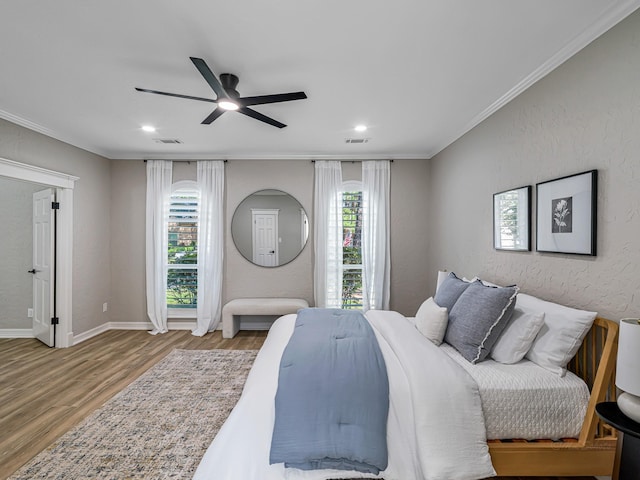 20647 Laurel Lock Dr, Katy, TX 77450 - bedroom with wood finished floors, multiple windows, recessed lighting, crown molding, and baseboards