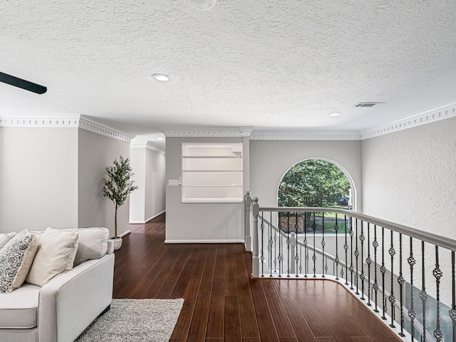 20647 Laurel Lock Dr, Katy, TX 77450 - hall featuring a textured ceiling, an upstairs landing, wood finished floors, and recessed lighting