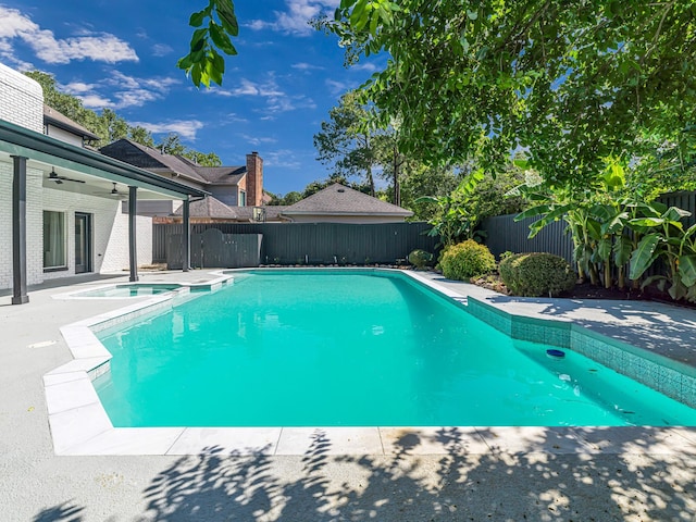 20647 Laurel Lock Dr, Katy, TX 77450 - view of swimming pool featuring ceiling fan, a fenced backyard, a patio, and a pool with connected hot tub