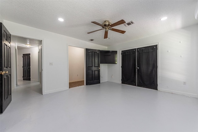 15329 Cedar St, Santa Fe, TX 77517 - unfurnished bedroom featuring a textured ceiling, baseboards, finished concrete floors, recessed lighting, and ceiling fan