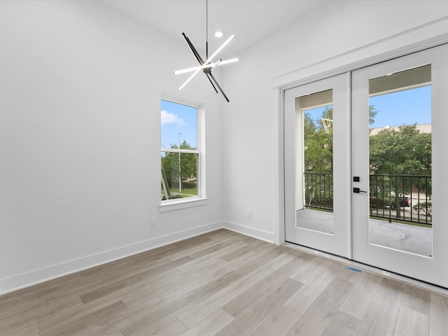 5203 San Juan St, Houston, TX 77020 - unfurnished dining area with light wood-type flooring, healthy amount of natural light, french doors, recessed lighting, and baseboards