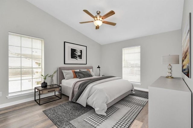 10101 S Gessner Rd Unit 811, Houston, TX 77071 - bedroom featuring vaulted ceiling, baseboards, light wood-type flooring, and a ceiling fan