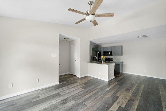 10101 S Gessner Rd Unit 811, Houston, TX 77071 - unfurnished living room with dark wood-type flooring, a ceiling fan, baseboards, and a sink