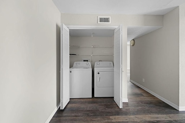 10101 S Gessner Rd Unit 811, Houston, TX 77071 - clothes washing area with independent washer and dryer, dark wood-type flooring, and baseboards