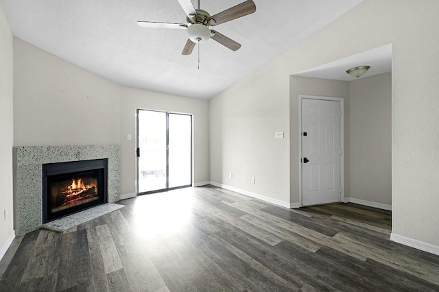 10101 S Gessner Rd Unit 811, Houston, TX 77071 - unfurnished living room with wood finished floors, a fireplace with flush hearth, ceiling fan, baseboards, and vaulted ceiling