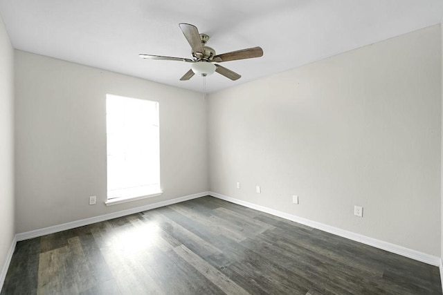 10101 S Gessner Rd Unit 811, Houston, TX 77071 - unfurnished room with dark wood-style floors, baseboards, and a ceiling fan