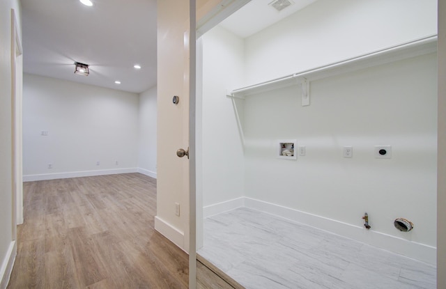 1853 Lombardy St, Houston, TX 77023 - clothes washing area with gas dryer hookup, hookup for a washing machine, hookup for an electric dryer, recessed lighting, and light wood-style flooring