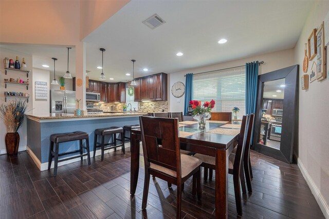 3207 Pheasant Trail Dr, Sugar Land, TX 77498 - dining area with baseboards, recessed lighting, and dark wood-type flooring