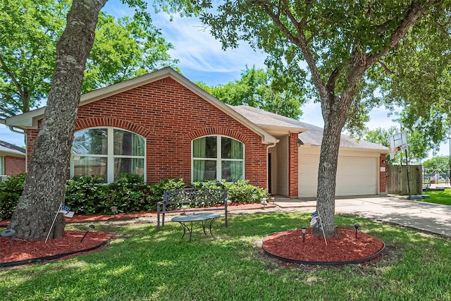 3207 Pheasant Trail Dr, Sugar Land, TX 77498 - ranch-style home with brick siding, a garage, a front yard, and driveway