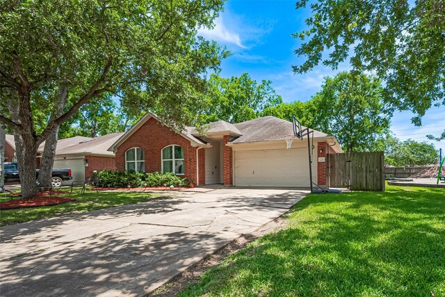 3207 Pheasant Trail Dr, Sugar Land, TX 77498 - ranch-style home featuring brick siding, an attached garage, and driveway