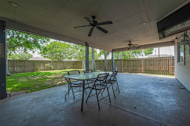 3207 Pheasant Trail Dr, Sugar Land, TX 77498 - view of patio with ceiling fan, a fenced backyard, and outdoor dining area