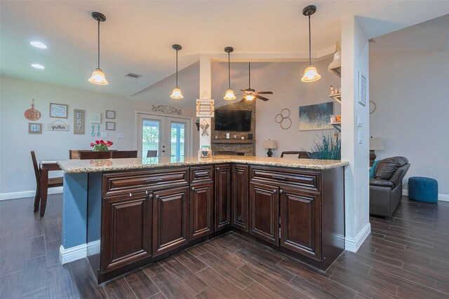 3207 Pheasant Trail Dr, Sugar Land, TX 77498 - kitchen featuring baseboards, dark brown cabinetry, a ceiling fan, lofted ceiling, and dark wood-style flooring