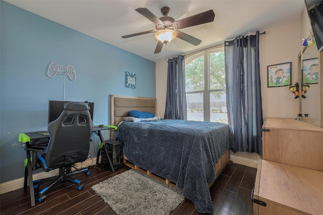 3207 Pheasant Trail Dr, Sugar Land, TX 77498 - bedroom featuring dark wood-style flooring, a desk, baseboards, and ceiling fan
