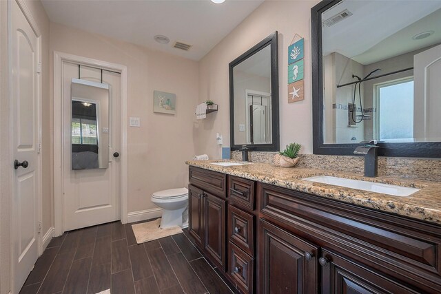 3207 Pheasant Trail Dr, Sugar Land, TX 77498 - bathroom featuring healthy amount of natural light, a shower, toilet, and baseboards