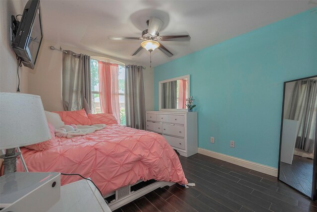 3207 Pheasant Trail Dr, Sugar Land, TX 77498 - bedroom with baseboards, dark wood-type flooring, and ceiling fan