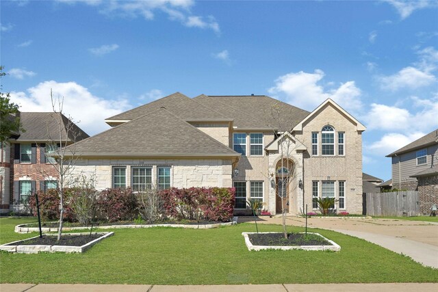 2108 Asbury Ct, Pearland, TX 77581 - view of front of house featuring a shingled roof and stone siding