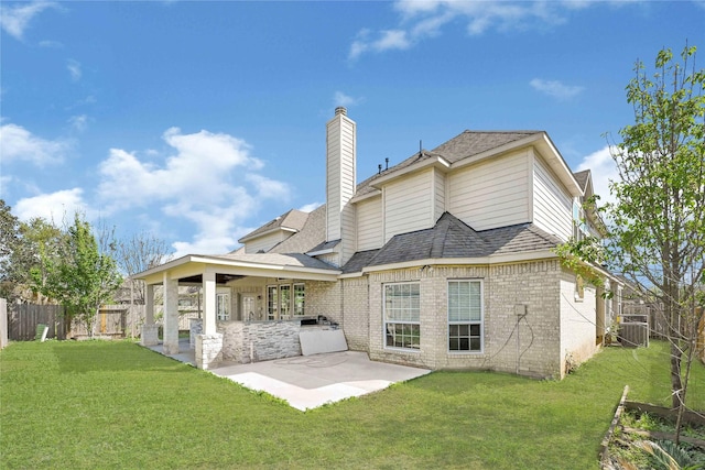 2108 Asbury Ct, Pearland, TX 77581 - back of property with a patio, brick siding, a chimney, and roof with shingles