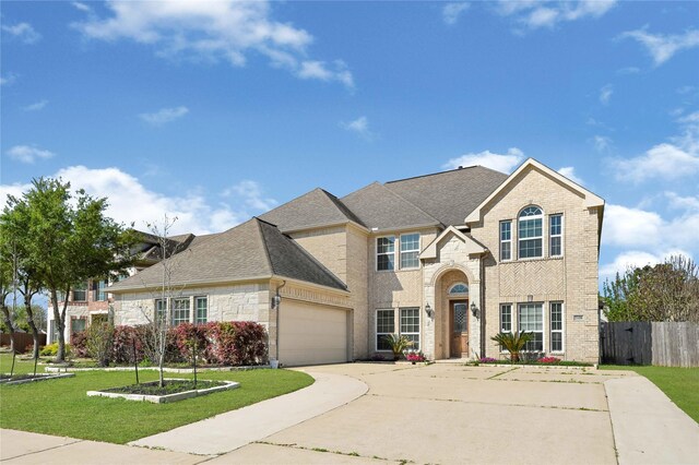 2108 Asbury Ct, Pearland, TX 77581 - traditional-style home featuring driveway, brick siding, an attached garage, and a shingled roof