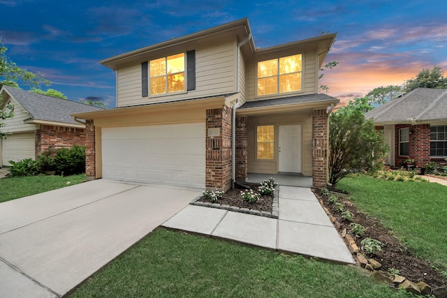 5043 Canyon Blanco Dr, Houston, TX 77045 - traditional-style home featuring concrete driveway, a garage, a front lawn, and brick siding