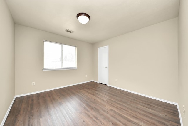 5043 Canyon Blanco Dr, Houston, TX 77045 - spare room featuring dark wood finished floors and baseboards
