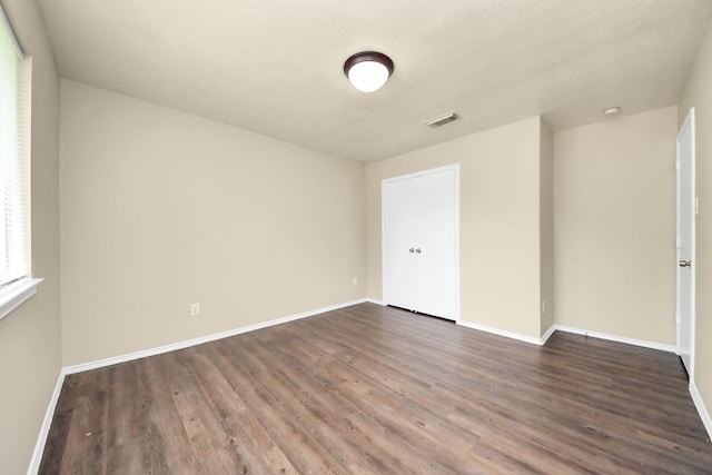 5043 Canyon Blanco Dr, Houston, TX 77045 - unfurnished room with dark wood-style floors and baseboards