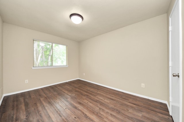 5043 Canyon Blanco Dr, Houston, TX 77045 - spare room with dark wood finished floors and baseboards