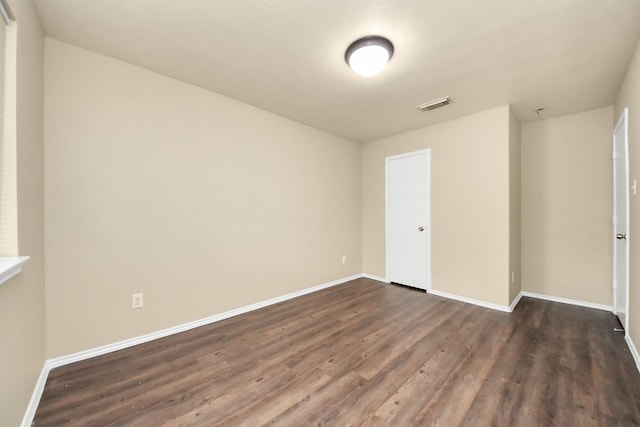 5043 Canyon Blanco Dr, Houston, TX 77045 - empty room with dark wood-style floors and baseboards
