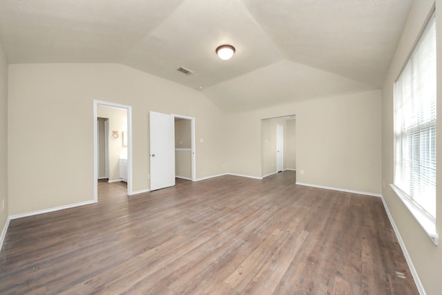 5043 Canyon Blanco Dr, Houston, TX 77045 - unfurnished bedroom featuring lofted ceiling, wood finished floors, and baseboards