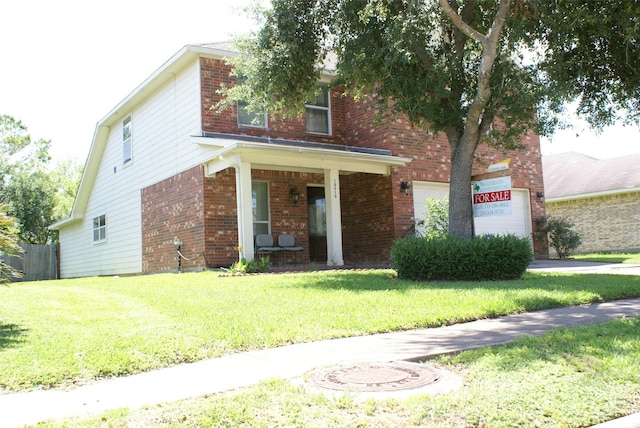 10910 Great Hawk Ln, Houston, TX 77075 - view of front of home with brick siding, a front yard, an attached garage, and a porch
