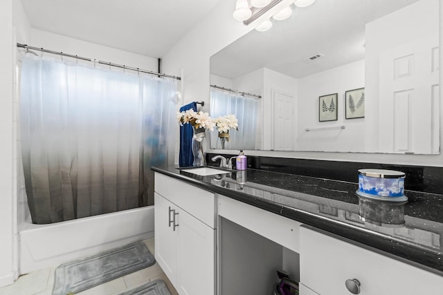 full bath with tile patterned flooring, vanity, and shower / bath combo