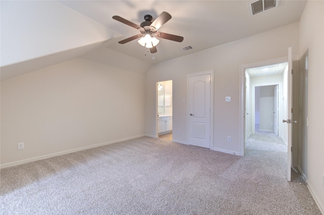 28015 Heritage Stream Dr, Katy, TX 77494 - unfurnished bedroom with light carpet, lofted ceiling, and baseboards