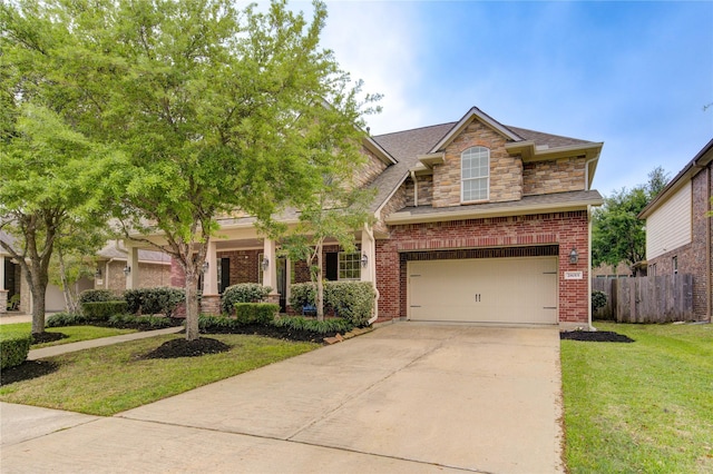 28015 Heritage Stream Dr, Katy, TX 77494 - view of front of property with concrete driveway, an attached garage, brick siding, stone siding, and roof with shingles